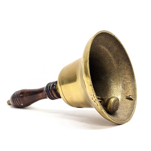 24 - An early 20th century brass school bell. 25cm