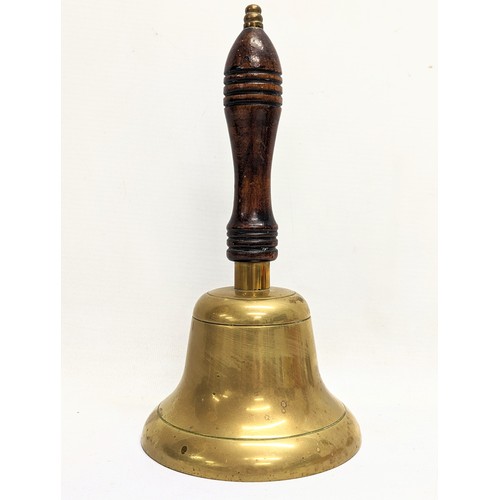 24 - An early 20th century brass school bell. 25cm