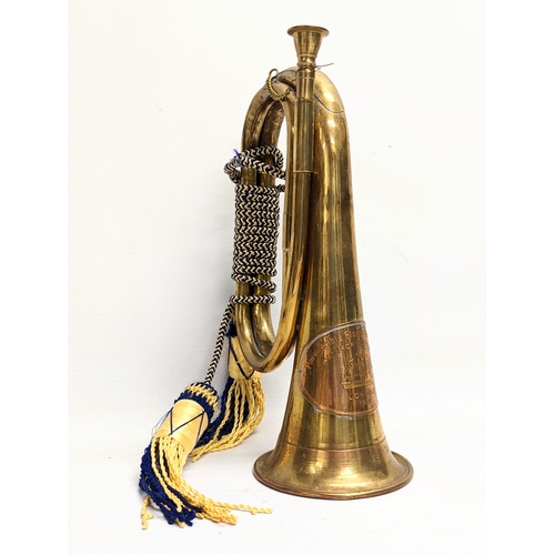 196 - An early 20th century brass bugle with early 20th century copper and brass hunting horn.