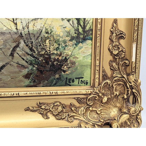 12 - A large oil painting by Leo Toye in ornate gilt frame. 91x66cm with frame, 74x49cm without frame.