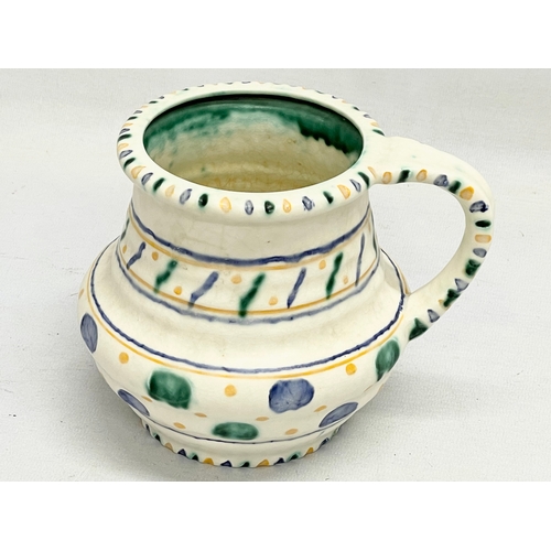 662 - A Charlotte Rhead pottery jug, designed for Crown Ducal. 16x13cm