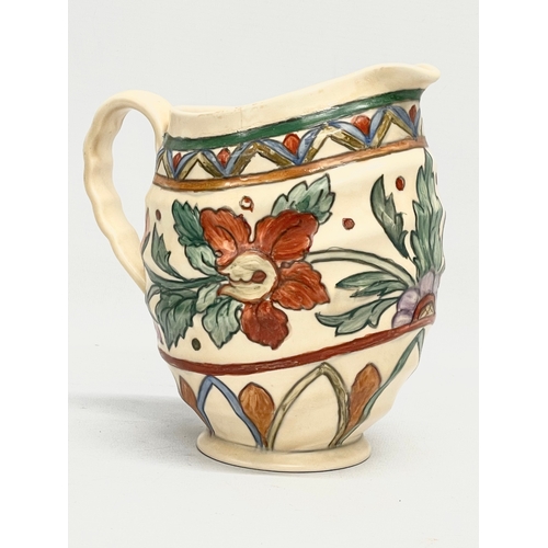 665 - A signed Crown Ducal pottery jug. 18x17cm