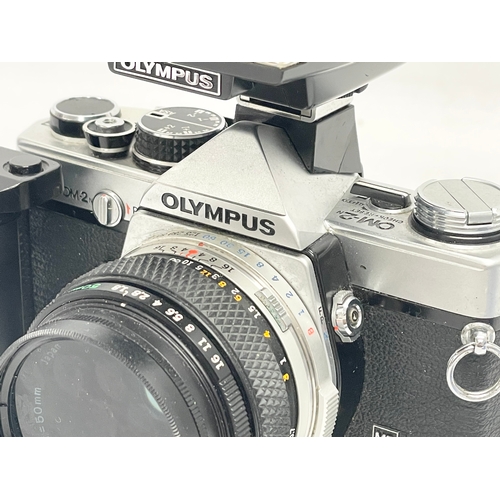 279 - An Olympus OM-2N camera with flash.