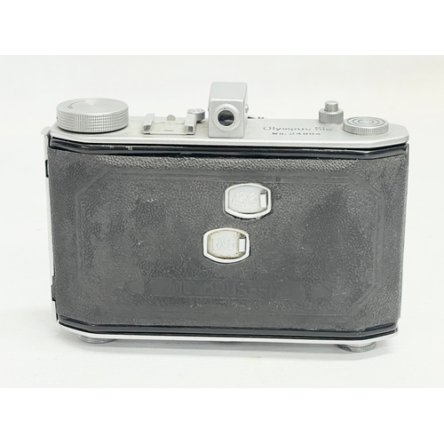 293 - An Olympus Six folding camera. 24894. 6x6 4.5x6.