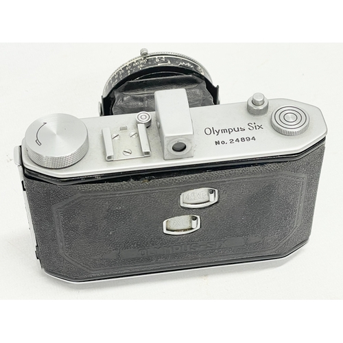 293 - An Olympus Six folding camera. 24894. 6x6 4.5x6.