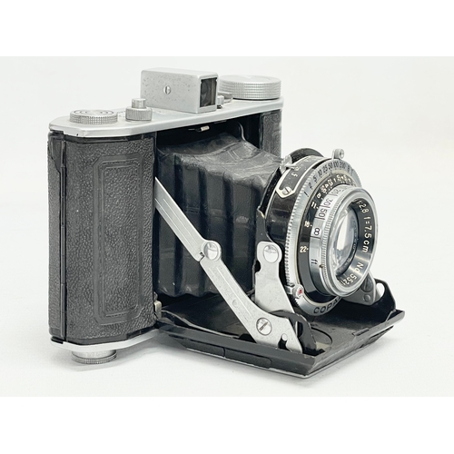 293 - An Olympus Six folding camera. 24894. 6x6 4.5x6.