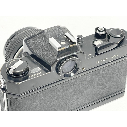 303 - A Nikon Nikkormat FT2 camera. 5155977