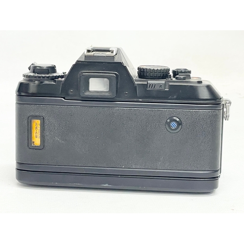 305 - A Nikon F-301 camera.