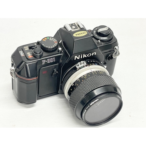 305 - A Nikon F-301 camera.