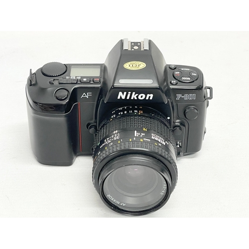 310 - A Nikon F-801 AF camera.