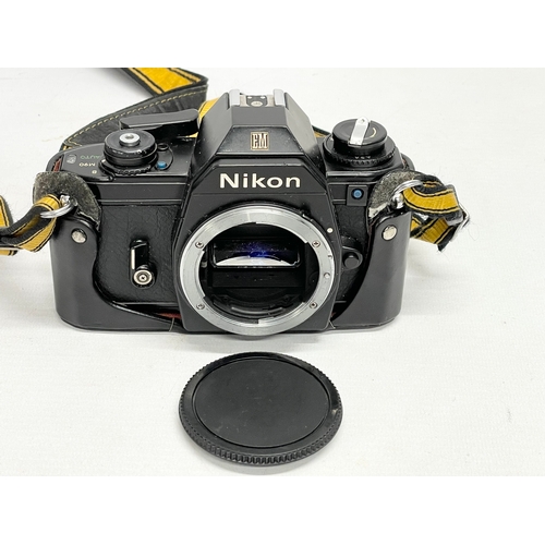 314 - A Nikon EM camera in case.