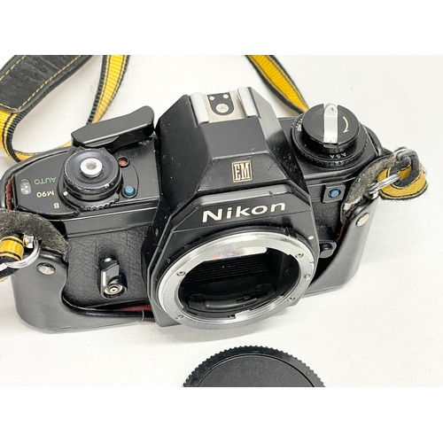 314 - A Nikon EM camera in case.