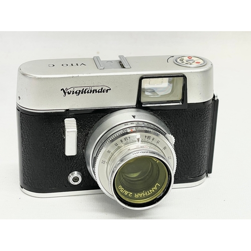 411 - 3 Voigtlander cameras. A Voigtlander Vitessa camera, a Voigtlamder Vito B camera and a Voigtlander V... 