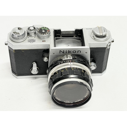 415 - A Nikon F camera and a Nikon F-301 camera.