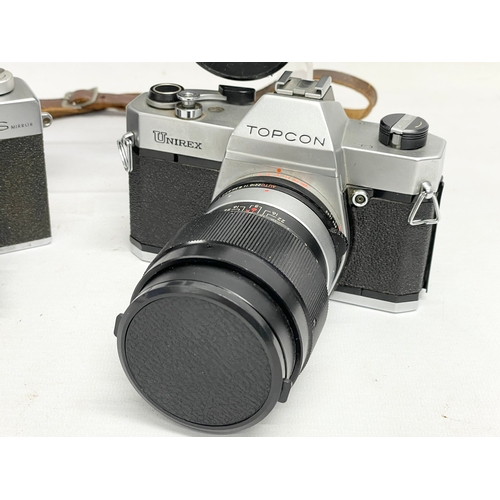 417 - 4 vintage cameras. A Topcon Unirex camera. A Topcon Wink S Mirror camera. A Zenit TTL camera and an ... 