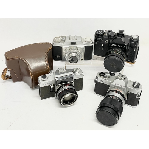 417 - 4 vintage cameras. A Topcon Unirex camera. A Topcon Wink S Mirror camera. A Zenit TTL camera and an ... 