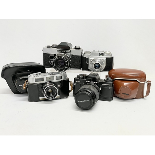 418 - 4 vintage cameras. A Praktica BC1 Electronic camera. A Rank Mamiya camera. An Exakta RTL 1000 camera... 