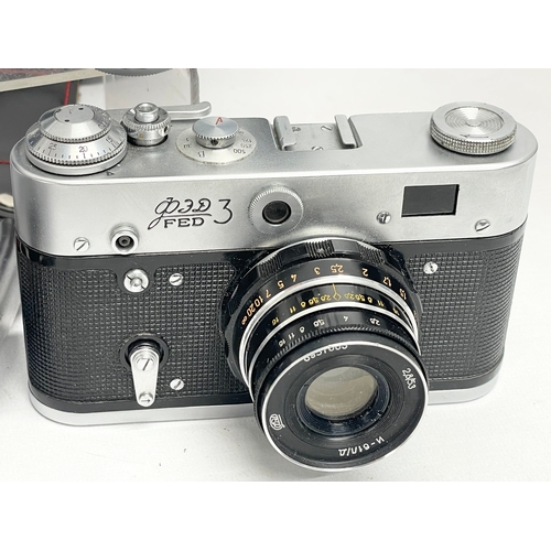 419 - 4 vintage cameras. A Zeiss Ikon Contessa camera. A lloca Quick-B camera. A FED 3 camera. A Petri 7S ... 