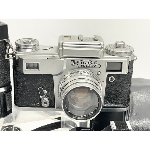 421 - 4 vintage cameras. A Kwed Kiev camera. A Kowa SE camera. A Chinon CM-4S camera in case. A Konica FP-... 