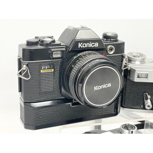 421 - 4 vintage cameras. A Kwed Kiev camera. A Kowa SE camera. A Chinon CM-4S camera in case. A Konica FP-... 