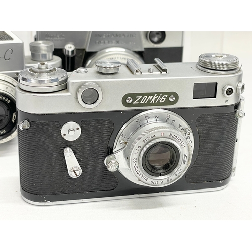 428 - A collection of vintage cameras. A Zeiss Ikon Nettar folding camera. A Zorki-6 camera. A Zenit C cam... 