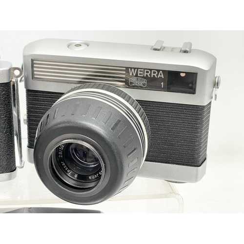 428 - A collection of vintage cameras. A Zeiss Ikon Nettar folding camera. A Zorki-6 camera. A Zenit C cam... 