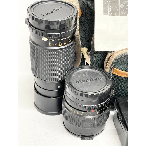 429 - A quantity of Mamiya camera equipment, including parts of the M645 Super camera. etc. A Mamiya pisto... 