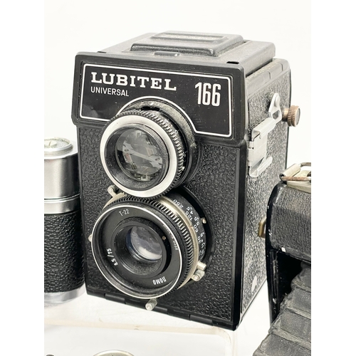 432 - A collection of vintage cameras. A Zeiss Ikon Compur Rapid folding camera. A Lubitel 166 Universal c... 