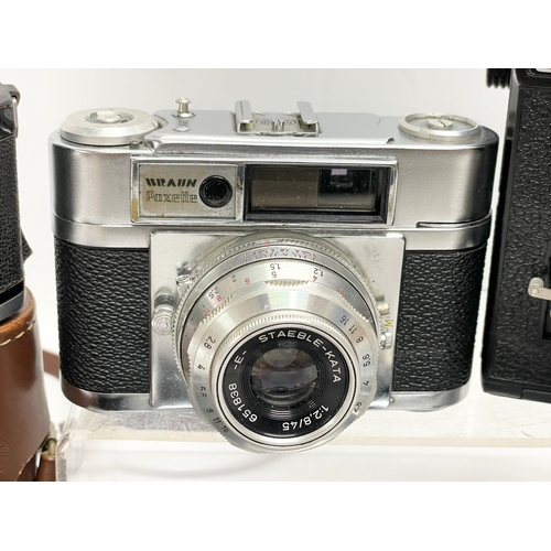 432 - A collection of vintage cameras. A Zeiss Ikon Compur Rapid folding camera. A Lubitel 166 Universal c... 