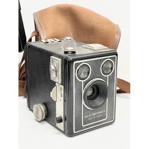 436 - A quantity of vintage folding cameras and brownies. Some with cases. A Kodak Six-20 folding camera i... 