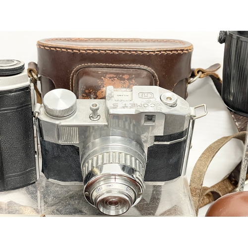 437 - A collection of vintage cameras. A Rolleiflex SL35 M camera in case. A Voigtlander Vitoret camera in... 