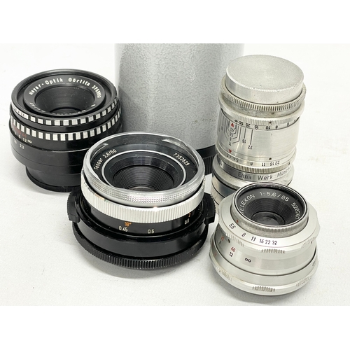 440 - 4 German camera lenses. A Leitz Wetzlar Elmaron 1:36/200mm lens. A Staeble Telexon 1:56/85 528767 E ... 