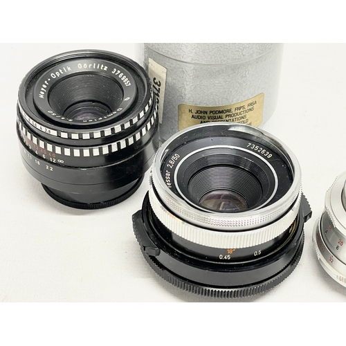 440 - 4 German camera lenses. A Leitz Wetzlar Elmaron 1:36/200mm lens. A Staeble Telexon 1:56/85 528767 E ... 