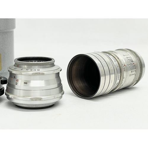 440 - 4 German camera lenses. A Leitz Wetzlar Elmaron 1:36/200mm lens. A Staeble Telexon 1:56/85 528767 E ... 