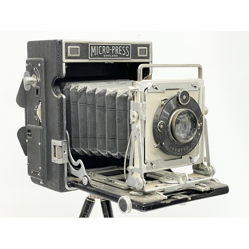 444 - A Micro-Precision Products Micro-Press folding plate camera on stand.