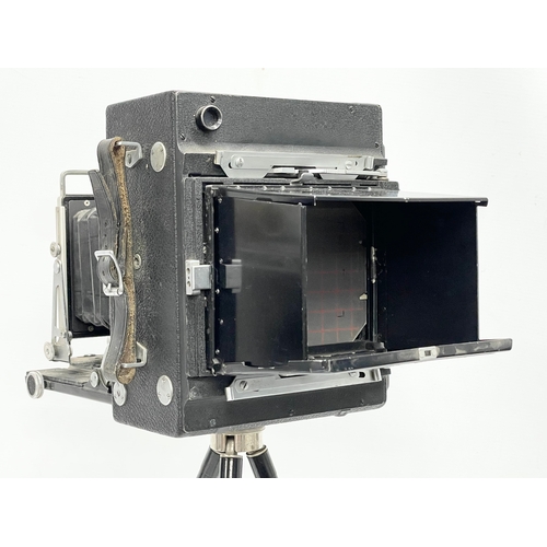 444 - A Micro-Precision Products Micro-Press folding plate camera on stand.