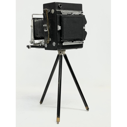 444 - A Micro-Precision Products Micro-Press folding plate camera on stand.