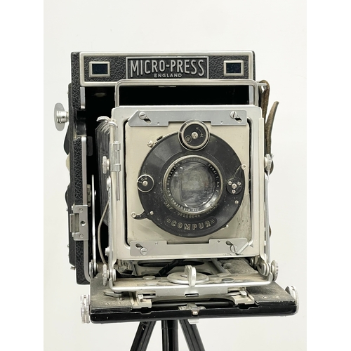 444 - A Micro-Precision Products Micro-Press folding plate camera on stand.