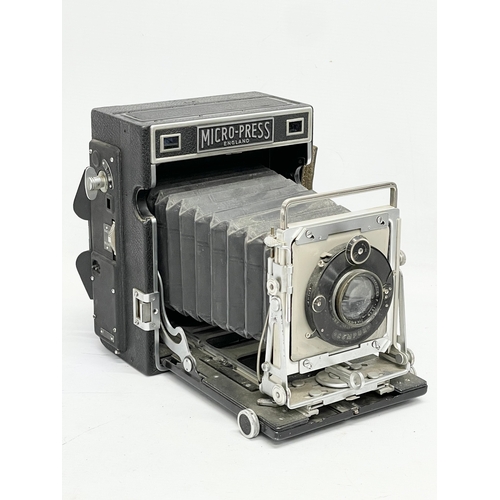 444 - A Micro-Precision Products Micro-Press folding plate camera on stand.