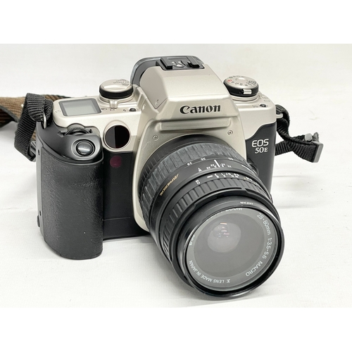 452 - A Canon EOS 50E camera in case with filters etc.