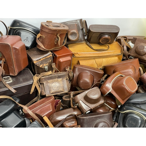 457 - A large quantity of vintage camera cases.