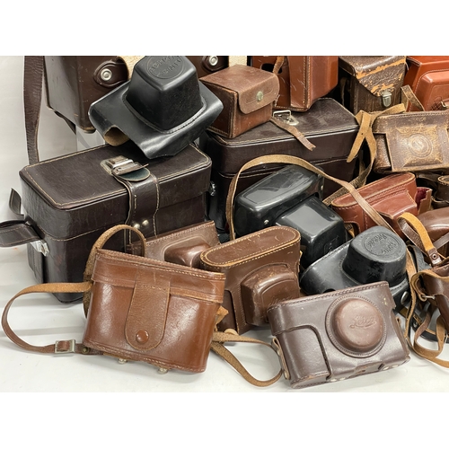 457 - A large quantity of vintage camera cases.