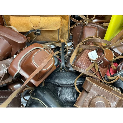 457 - A large quantity of vintage camera cases.