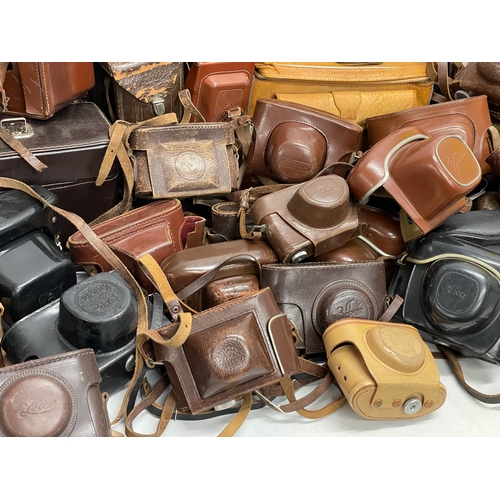 457 - A large quantity of vintage camera cases.