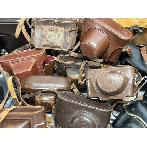 457 - A large quantity of vintage camera cases.