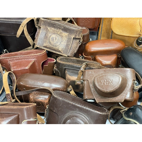 457 - A large quantity of vintage camera cases.