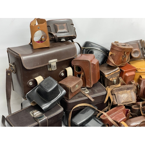 457 - A large quantity of vintage camera cases.