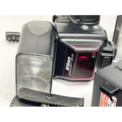 461 - A quantity of camera flashes and equipment etc. a Metz Mecablitz 60 CT-4. A Nikon Quick Charger MH-2... 