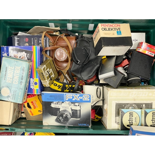 466 - A large quantity of camera equipment, accessories, booklets, filters etc.