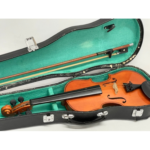 534 - A Violin in case.